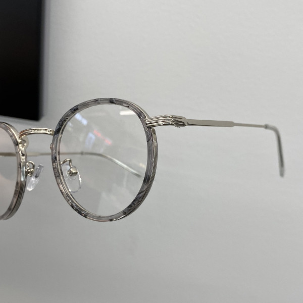 Stiilsed ümara kuju ja metallraamiga naiste prillid
