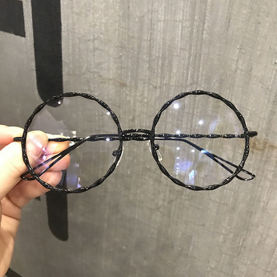 Hétköznapi női szemüveg kerek formával, fém kerettel