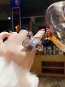 Moodne naiste reguleeritav lillekujuliste kivikestega sõrmus