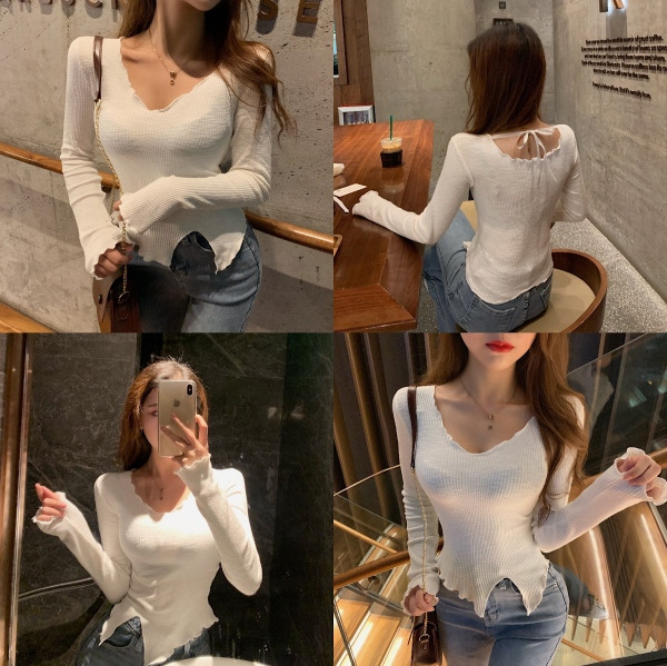 Testhezálló női blúz ovális nyakkivágással, szakadt motívumokkal