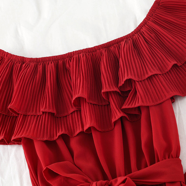 Stílusos női overall széles modell csónakos nyakkivágással és derékövvel