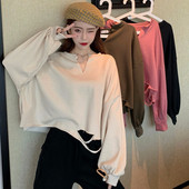 Széles női blúz szakadt motívumokkal