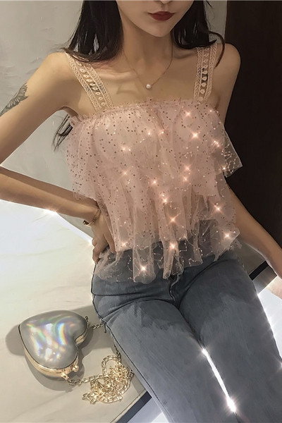 Modern női felső flitterekkel és csipkepántokkal