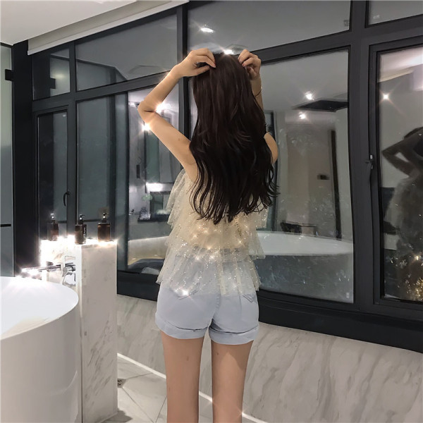 Modern női felső flitterekkel és csipkepántokkal