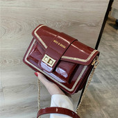 Modern női lakkbőr táska hosszú fém fogantyúval