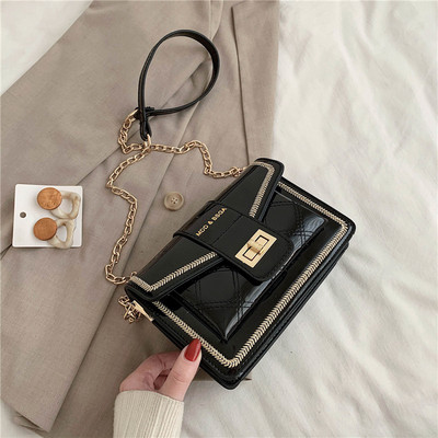 Modern női lakkbőr táska hosszú fém fogantyúval