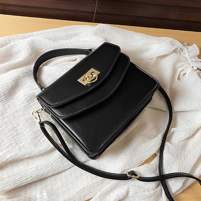 Stiilne kahe sanga ja metallist kinnitusega naistekott