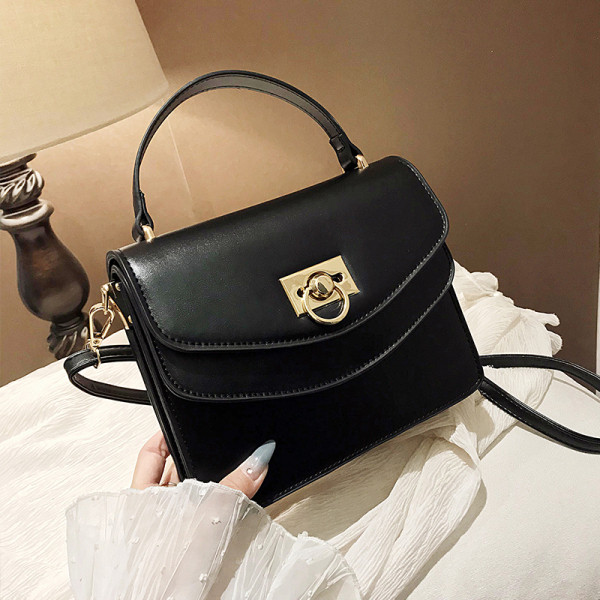 Stiilne kahe sanga ja metallist kinnitusega naistekott