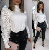 Moderni moteriška palaidinė su aukšta apykakle ir tiuliu ant rankovių baltos spalvos