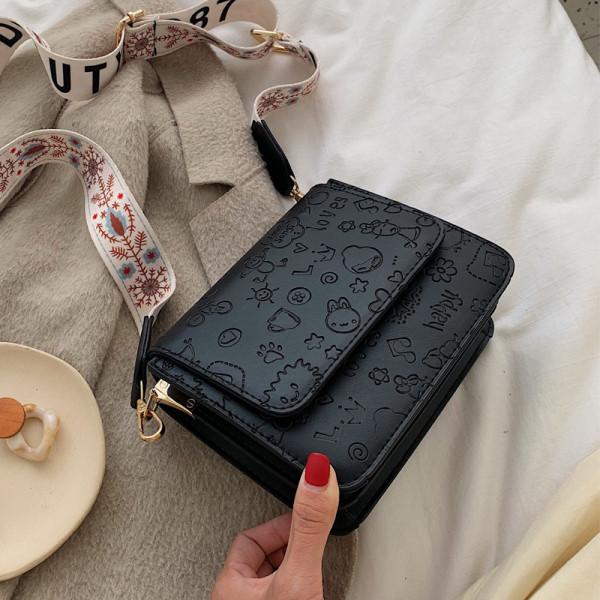 Reljeefse katte ja laia värvilise käepidemega vabaaja naiste nahkkott