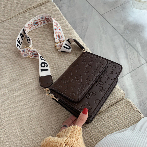 Reljeefse katte ja laia värvilise käepidemega vabaaja naiste nahkkott