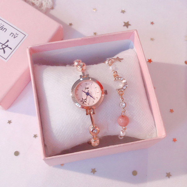 Актуален дамски часовник в кръгла форма с метална каишка и гривна