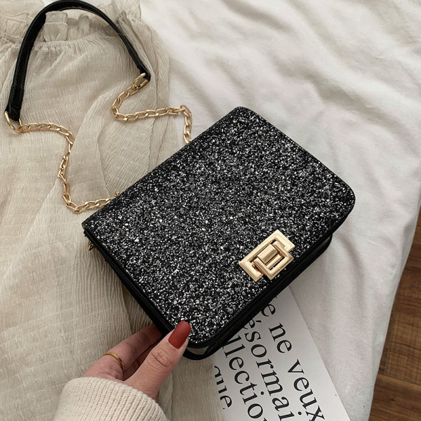 Modernus moteriškas krepšys su blizgiomis dalelėmis ir ilga rankena