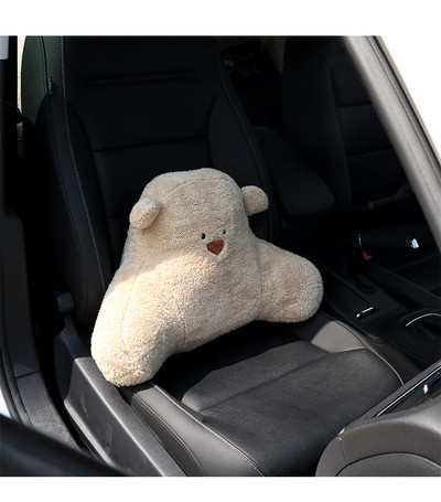 Comfortable plush cross pillow in the shape of a bear suitable for a car