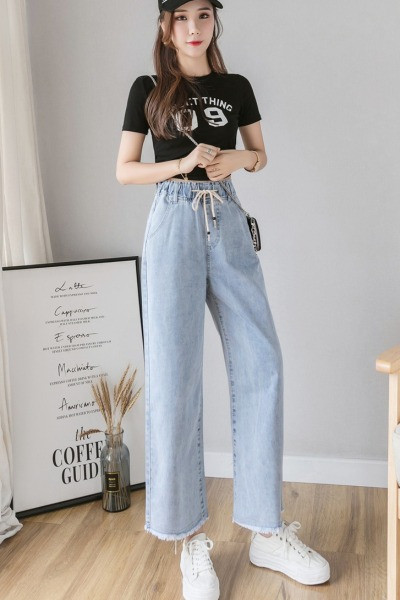 Széles női farmer fűzővel és magas derékkal