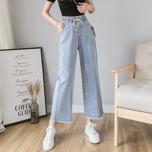 Széles női farmer fűzővel és magas derékkal