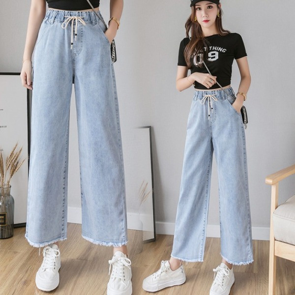 Széles női farmer fűzővel és magas derékkal