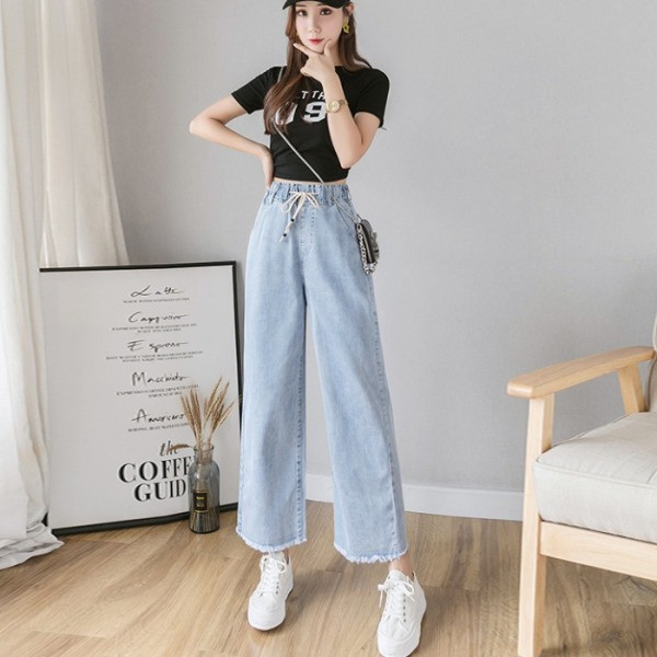 Széles női farmer fűzővel és magas derékkal