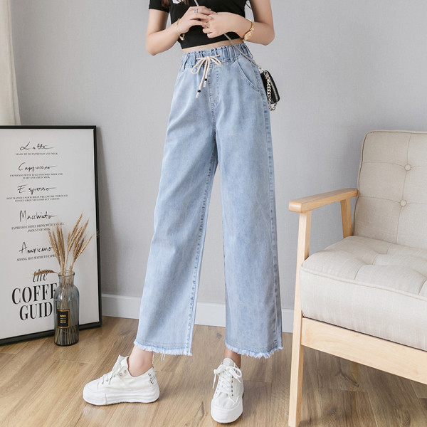 Széles női farmer fűzővel és magas derékkal