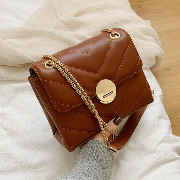 Eko bőrből készült stílusos női táska, hosszú fém fogantyúval