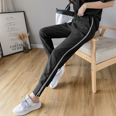 Női alkalmi nadrág nyakkendővel és cipzárral