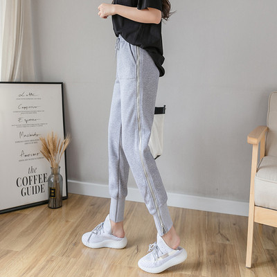 Női alkalmi nadrág nyakkendővel és cipzárral