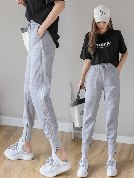 Női alkalmi nadrág nyakkendővel és cipzárral