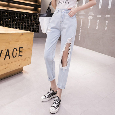 Lezser női farmer szakadt motívummal, magas derékkal - kék színben