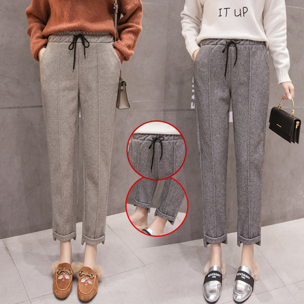 Modern női nadrág nyakkendővel és zsebekkel