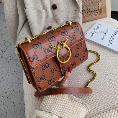 Naiste kaasaegne pika sanga ja metallist kinnitusega ökonahast kott