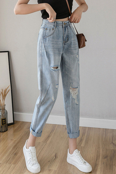 Alkalmi női farmer magas derékkal, szakadt motívumokkal