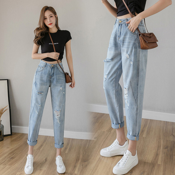 Alkalmi női farmer magas derékkal, szakadt motívumokkal