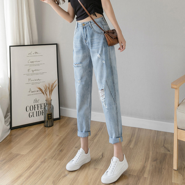 Alkalmi női farmer magas derékkal, szakadt motívumokkal