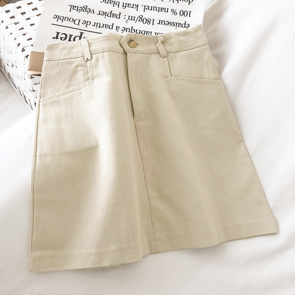 Női farmerszoknya magas derékkal és zsebekkel