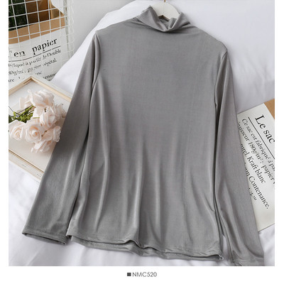 Modern női blúz pólógallérral, hosszú ujjal és rátéttel