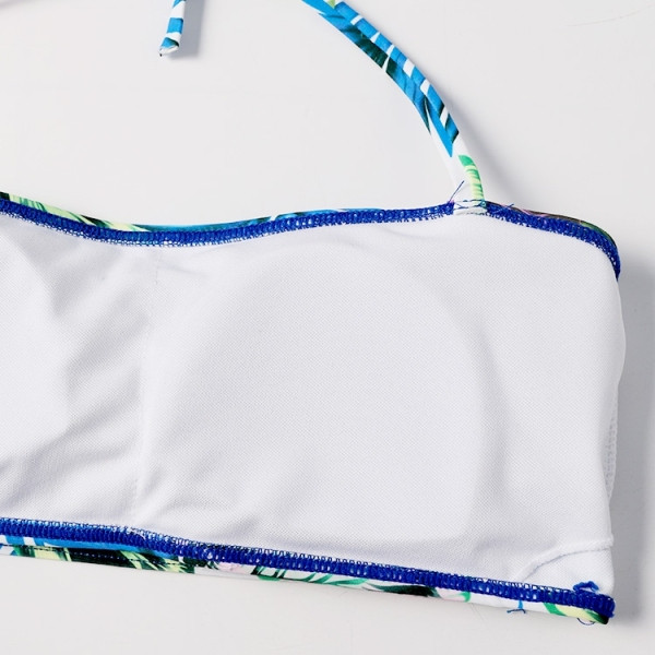 Sieviešu divdaļīgs peldkostīms ar ziedu rakstu un lentes augšdaļu