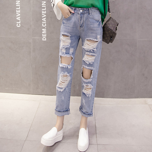 Нов модел дамски дънки със скъсани мотиви и висока талия