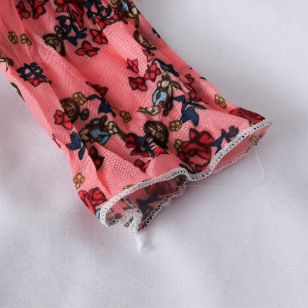 Tavaszi női blúz magas gallérral és virágmintával