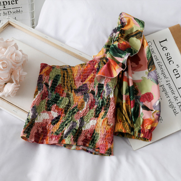 Elasztikus női blúz rövid modell egyujjal és virágmintával