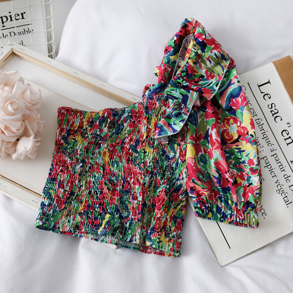 Elasztikus női blúz rövid modell egyujjal és virágmintával