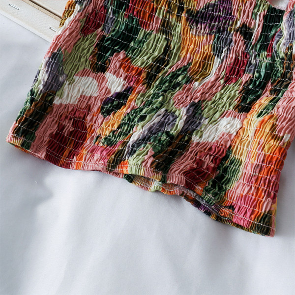 Elasztikus női blúz rövid modell egyujjal és virágmintával