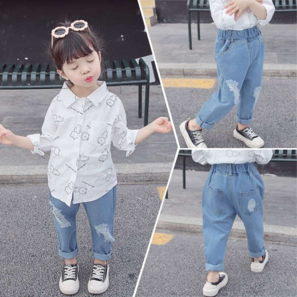 Bērnu džinsi ar kabatām un saplēstiem motīviem meitenēm