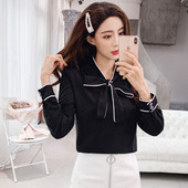 Hétköznapi női ing szalaggal és hosszú ujjal