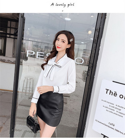 Hétköznapi női ing szalaggal és hosszú ujjal