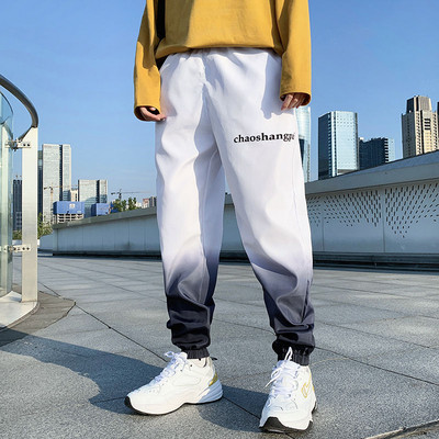 Ikdienas vīriešu bikses ar uzrakstu zaigojošās krāsās