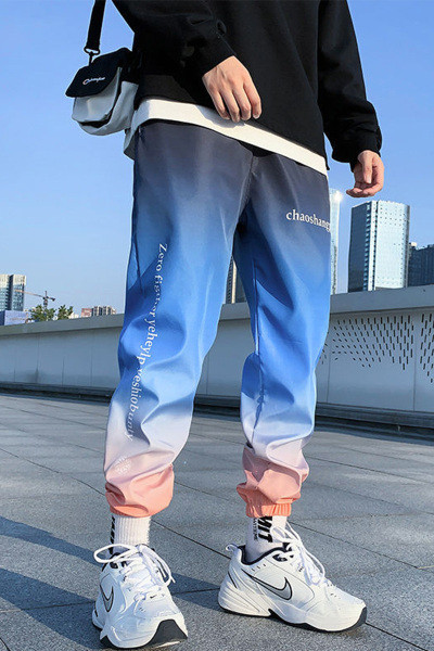 Ikdienas vīriešu bikses ar uzrakstu zaigojošās krāsās