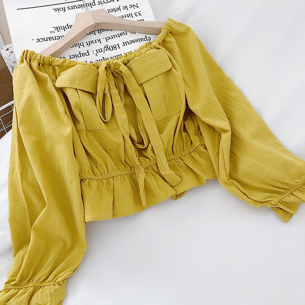 Μοντέρνα γυναικεία μπλούζα με μακριά μανίκια και κορδόνια