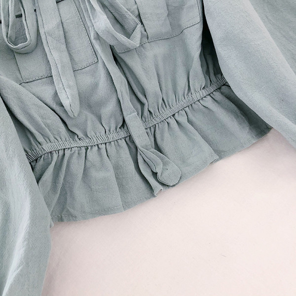 Μοντέρνα γυναικεία μπλούζα με μακριά μανίκια και κορδόνια