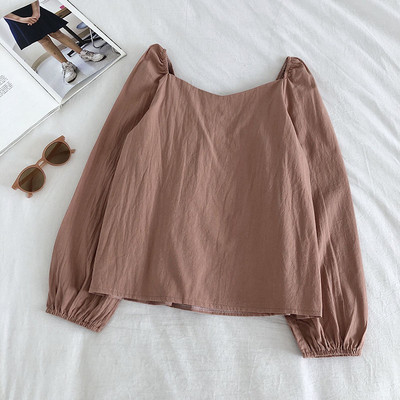 Μοντέρνα γυναικεία μπλούζα με φαρδιά μανίκια και λαιμόκοψη