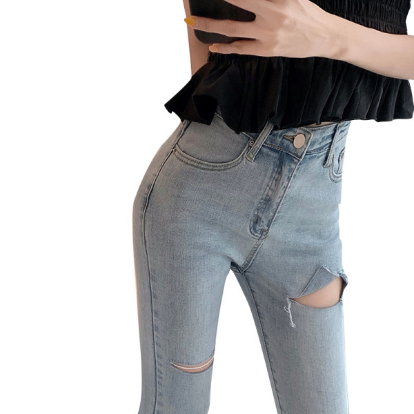 Lengvi moteriški džinsai Lieknas modelis aukštu liemeniu ir suplėšytais motyvais